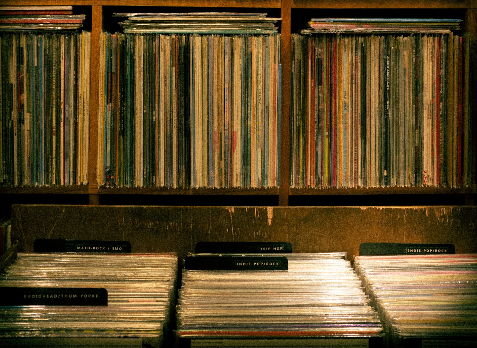 A shelf full of records in a room